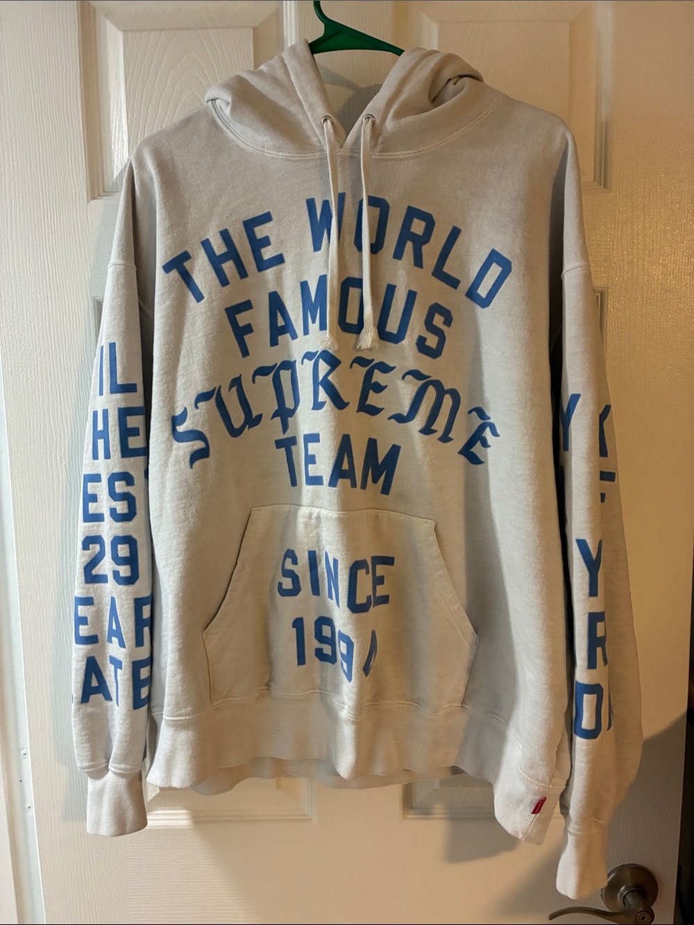 Supreme Cream Hoodie with Blue Team Graphic
